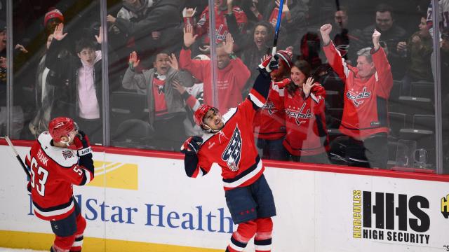 Washington Capitals right wing Justin Sourdif, right, celebrates his game-wining goal next to center Ethen Frank (53) in the overtime of an NHL hockey game against the Carolina Hurricanes, Saturday, Jan. 31, 2026, in Washington. (AP Photo/Nick Wass) Hurricanes_Capitals_Hockey_86092
