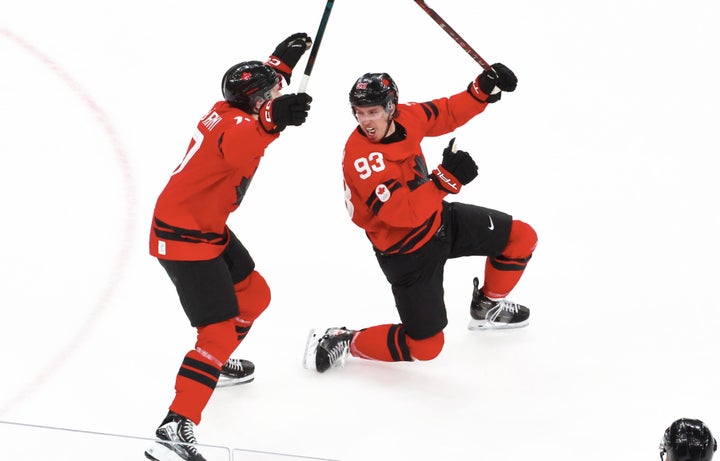 Team Canada's Mitch Marner (right) erupts in joy over his game-winning goal in overtime as Macklin Celebrini (left) celebrates following the men's ice hockey quarterfinals match against Czech Republic at Milano Santagiulia Ice Hockey Arena on Wednesday.