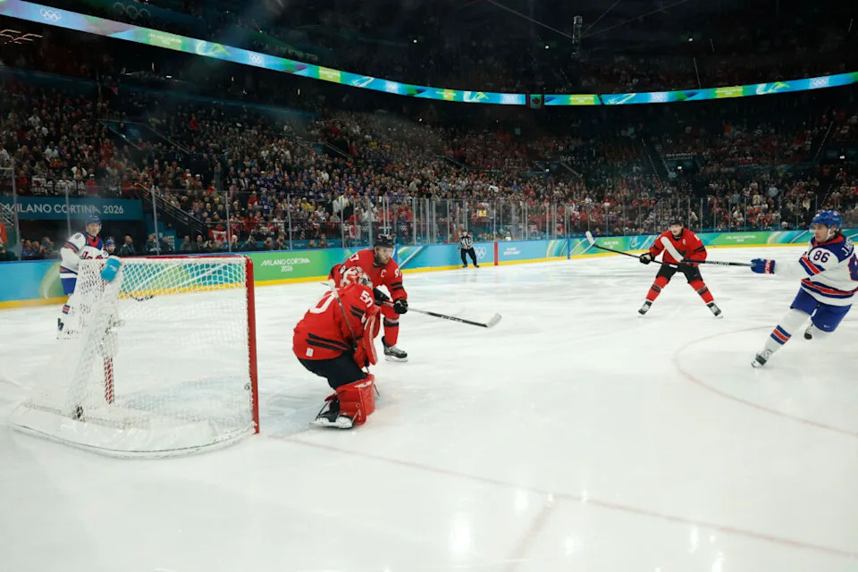 Jack Hughes #86 of Team United States scores the golden goal on Jordan Binnington #50 of Team Canada in overtime, while Connor McDavid fails to close the gap. Mandatory Credit: Geoff Burke-Imagn Images