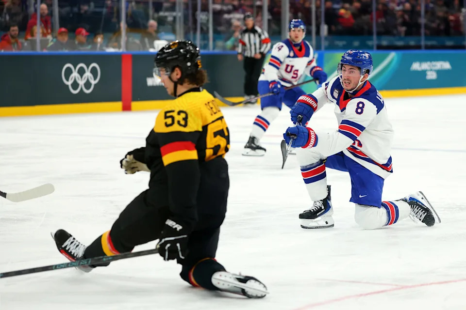 Zach Werenski #8 of Team United States shoots the puck against Moritz Seider #53 of Team Germany in the second period during the Men's Preliminary Group C match between the United States and Germany on day nine of the Milano Cortina 2026 Winter Olympic games at Milano Santagiulia Ice Hockey Arena on February 15, 2026 in Milan, Italy.