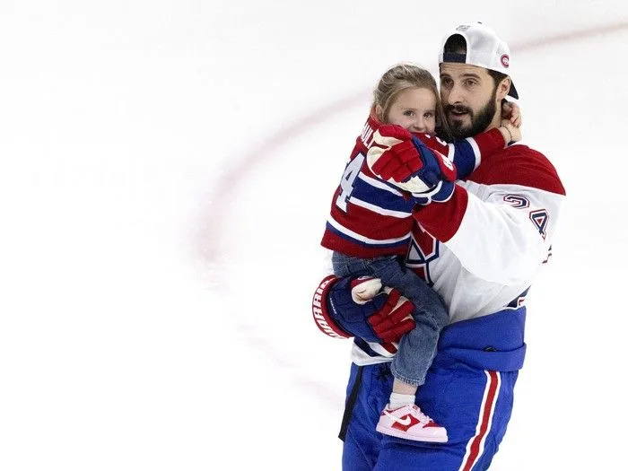  Montreal Canadiens centre Phillip Danault gives his daughter Adélia-Rose a skating tour of the rink during the team’s skills competition at the Bell Centre on Sunday, February 22, 2026.