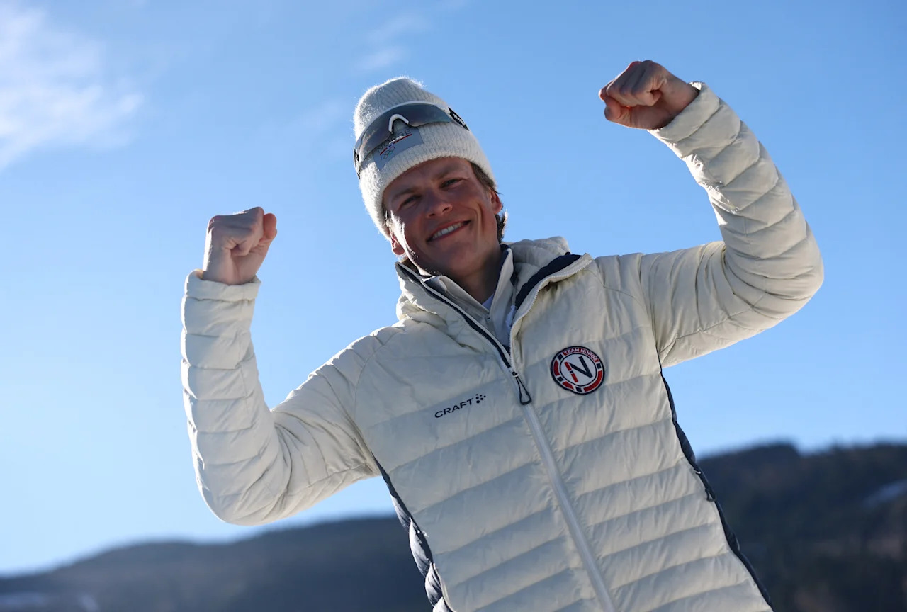 Milano Cortina 2026 Olympics - Cross-Country Skiing - Men's 10km Interval Start Free - Tesero Cross-Country Skiing Stadium, Lago, Italy - February 13, 2026. Gold medallist Johannes Hoesflot Klaebo of Norway reacts as he celebrates after winning the Men's 10km Interval Start Free REUTERS/Kai Pfaffenbach