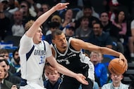Dallas Mavericks forward Cooper Flagg (32) defends against San Antonio Spurs forward Victor...