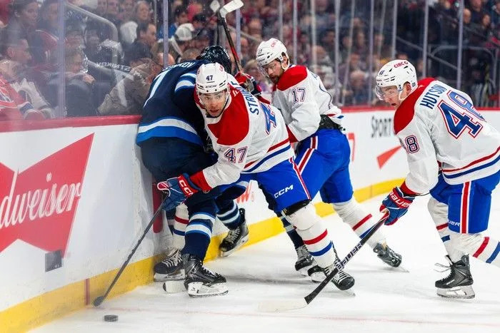  Jayden Struble (#47) of the Montreal Canadiens digs out the puck in the second period against the Winnipeg Jets at Canada Life Centre on February 4, 2026.