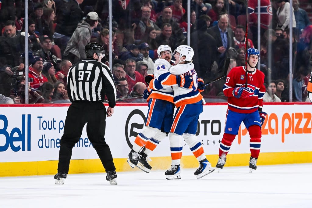 New York Islanders center Jean-Gabriel Pageau (44) celebrates his game winning goal against the Montreal Canadiens in during overtime at Bell Centre. David Kirouac-Imagn Images