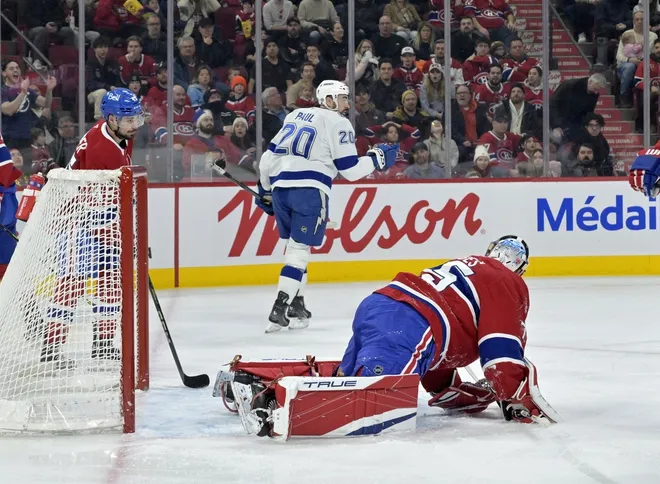 Feb 9, 2025; Montreal, Quebec, CAN; Tampa Bay Lightning forward Nicholas Paul (20) celebrates after scoring a goal against Montreal Canadiens goalie Jakub Dobes (75) during the first period at the Bell Centre.