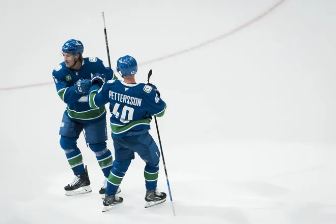 Nov 11, 2025; Vancouver, British Columbia, CAN; Vancouver Canucks forward Brock Boeser (6) and forward Elias Pettersson (40) celebrate Boeser’s goal against the Winnipeg Jets in the third period at Rogers Arena.