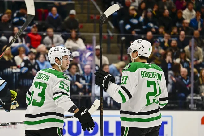 Jan 31, 2026; Salt Lake City, Utah, USA; Dallas Stars center Wyatt Johnston (53) and left wing Jason Robertson (21) celebrate after a goal during first period against the Utah Mammoth at Delta Center.