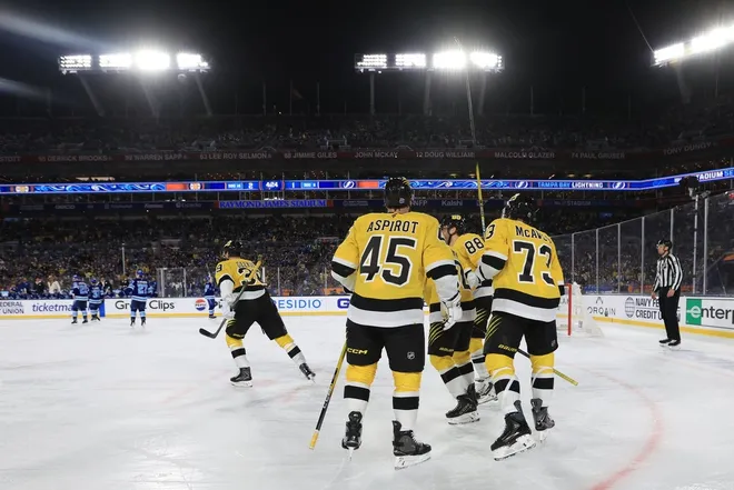 Feb 1, 2026; Tampa Bay, Florida, USA; Boston Bruins center Morgan Geekie (39) skates away from teammates after scoring a goal against the Tampa Bay Lightningv during the first period in the 2026 Stadium Series ice hockey game at Raymond James Stadium.