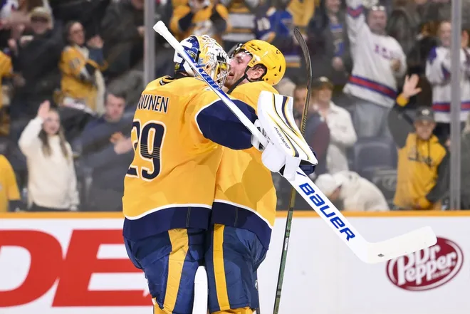 Feb 2, 2026; Nashville, Tennessee, USA; Nashville Predators center Ryan O'Reilly (90) celebrates the win with goaltender Justus Annunen (29) against the St. Louis Blues during the third period at Bridgestone Arena.
