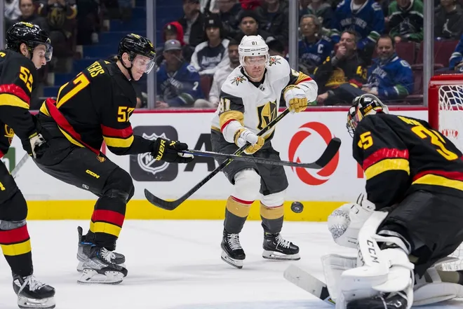 Mar 21, 2023; Vancouver, British Columbia, CAN; Vancouver Canucks defenseman Guillaume Brisebois (55) and defenseman Tyler Myers (57) watch as Vegas Golden Knights forward Jonathan Marchessault (81) shoots on goalie Thatcher Demko (35) in the second period at Rogers Arena.
