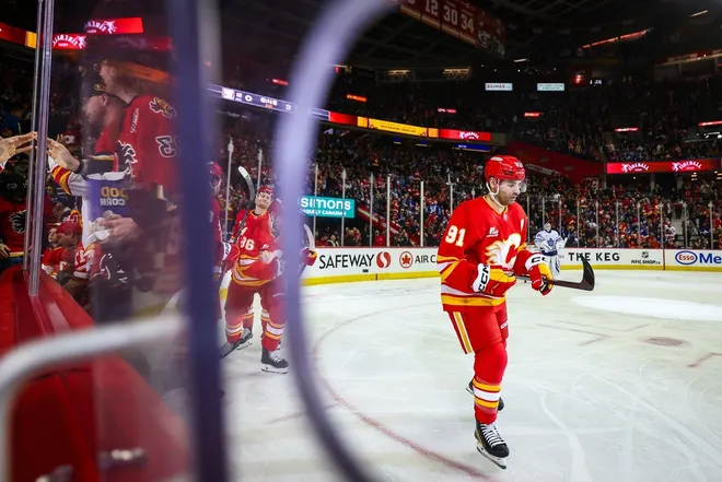 Feb 2, 2026; Calgary, Alberta, CAN; Calgary Flames center Nazem Kadri (91) celebrates his goal with teammates against the Toronto Maple Leafs during the second period at Scotiabank Saddledome.