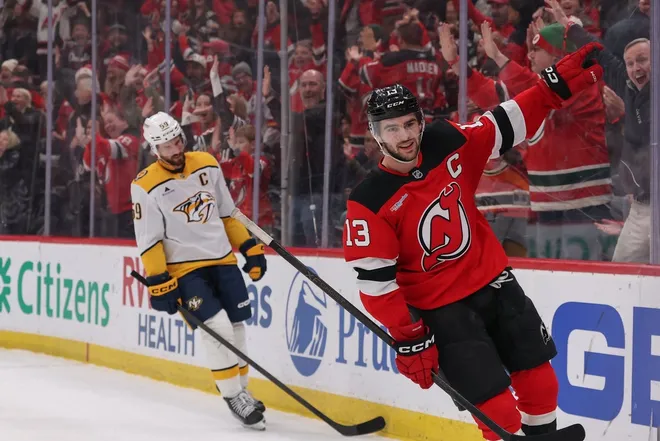 Jan 29, 2026; Newark, New Jersey, USA; New Jersey Devils center Nico Hischier (13) celebrates his overtime game winning goal against the Nashville Predators at Prudential Center.