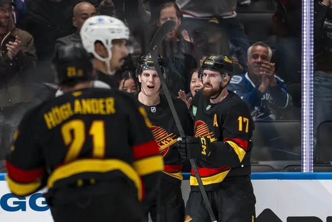 Jan 23, 2026; Vancouver, British Columbia, CAN; Vancouver Canucks defenseman Zeev Buium (24) and defenseman Filip Hronek (17) celebrate Buium’s goal against the New Jersey Devils in the second period at Rogers Arena.