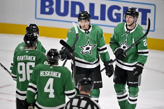 Feb 4, 2026; Dallas, Texas, USA; Dallas Stars left wing Jason Robertson (21) and center Wyatt Johnston (53) and right wing Mikko Rantanen (96) and defenseman Miro Heiskanen (4) and defenseman Esa Lindell (23) celebrates after Robertson scores a goal against the St. Louis Blues during the first period at the American Airlines Center.