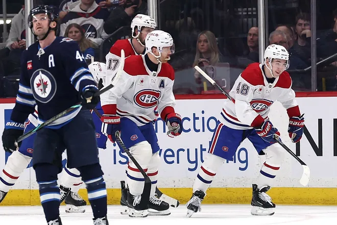Feb 4, 2026; Winnipeg, Manitoba, CAN; Montreal Canadiens defenseman Lane Hutson (48) celebrates a goal against the Winnipeg Jets in the second period at Canada Life Centre.