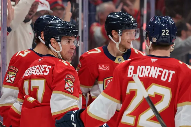 Feb 2, 2026; Sunrise, Florida, USA; Florida Panthers center Evan Rodrigues (17) celebrates with defenseman Tobias Bjornfot (22) after scoring against the Buffalo Sabres during the first period at Amerant Bank Arena.