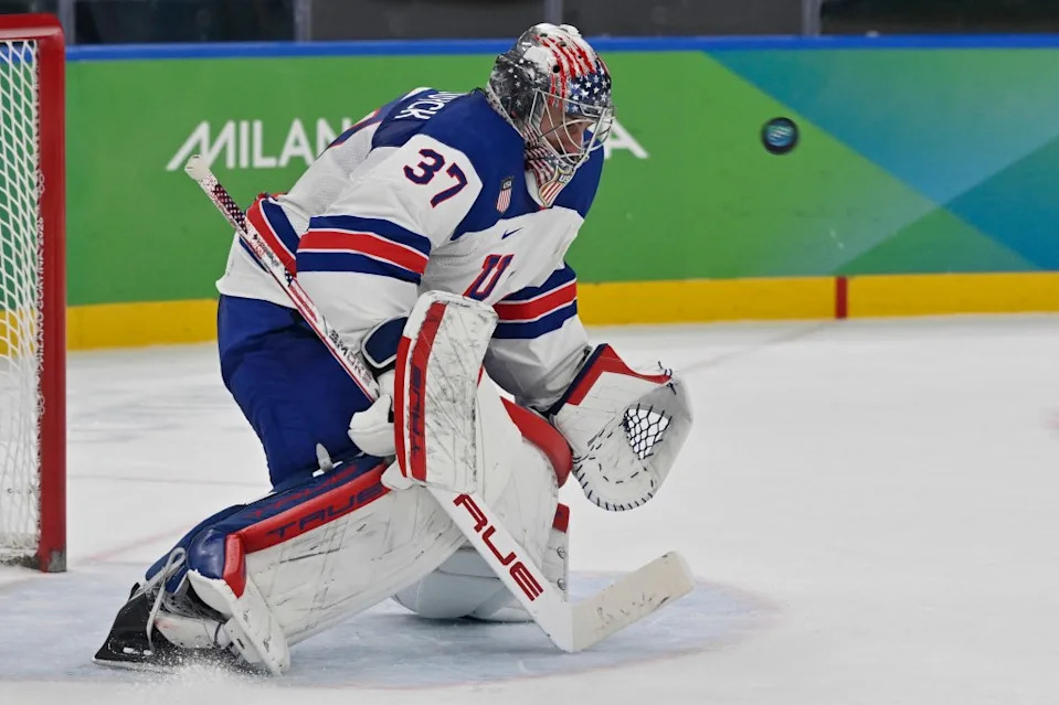 Connor Hellebuyck saves the puck during the men’s play-off semi-final ice hockey match between USA and Slovakia at the Milano Santagiulia Ice Hockey Arena during the Milano Cortina 2026 Winter Olympic Games in Milan, on February 20, 2026. AFP via Getty Images