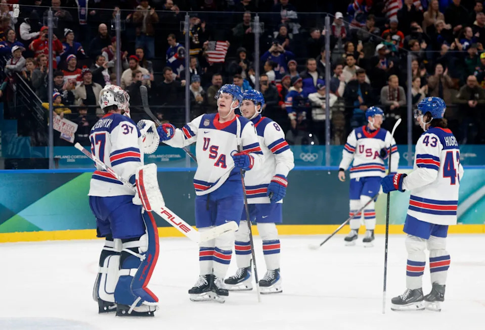 [US, Mexico & Canada customers only] Feb 12, 2026; Milan, Italy; Zach Werenski, Brady Tkachuk and Connor Hellebuyck of United States celebrate after the match against Latvia in men’s ice hockey group C play during the Milano Cortina 2026 Olympic Winter Games at Milano Santagiulia Ice Hockey Arena. Mandatory Credit: David W Cerny/Reuters via Imagn Images