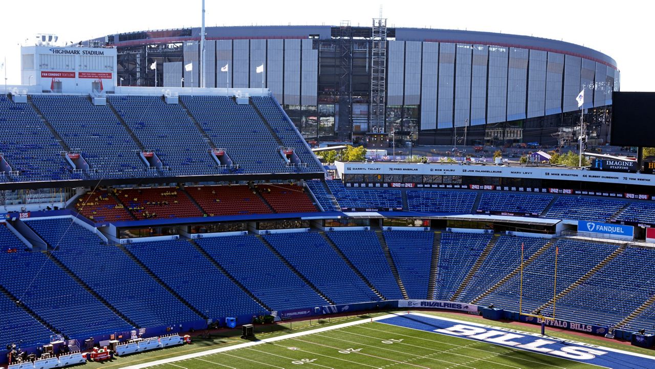 The old Highmark Stadium, foreground, frames the construction on the new Highmark Stadium, upper right, before an NFL football game between the Buffalo Bills and the New England Patriots, in Orchard Park, N.Y. on Oct. 5, 2025. (AP Photo/Gene J. Puskar)