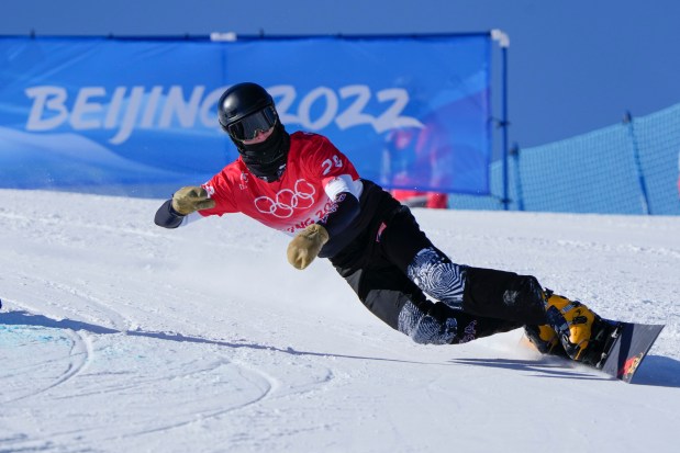 Cody Winters competes during the men's parallel giant slalom qualification run at the 2022 Winter Olympics, Tuesday, Feb. 8, 2022, in Zhangjiakou, China. (AP Photo/Lee Jin-man)
