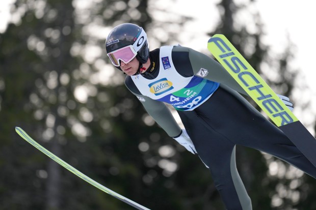 Niklas Malacinski of the United States competes in the Nordic Combined Mixed Team Normal Hill HS102/4x5km, Ski Jumping Round, at the Nordic World Ski Championships in Trondheim, Norway, Friday, Feb. 28, 2025. (AP Photo/Matthias Schrader)