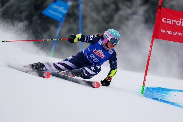Katie Hensien speeds down the course during a women's World Cup giant slalom, in Spindleruv Mlyn, Czech Republic, Saturday, Jan. 24, 2026. (AP Photo/Pier Marco Tacca)
