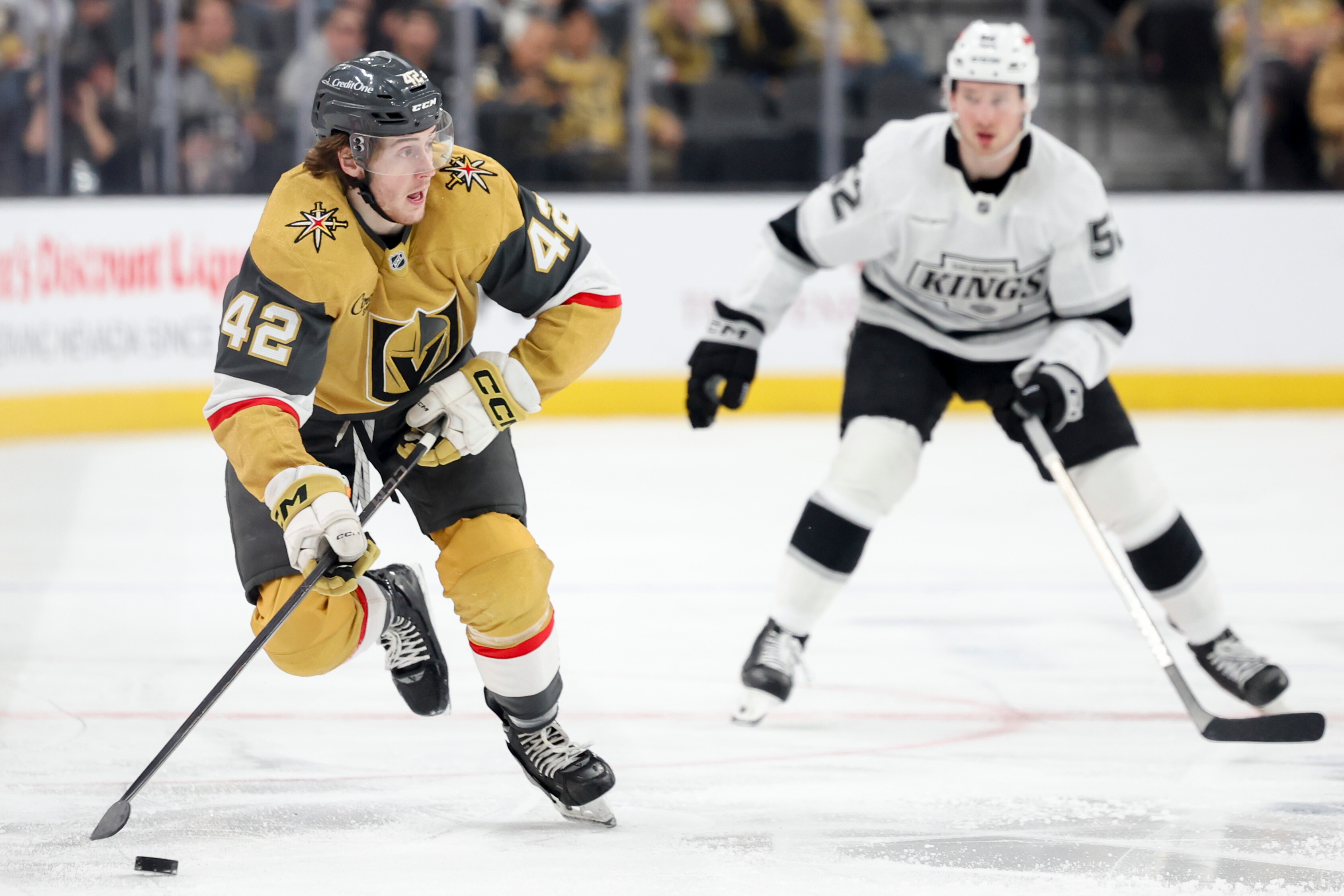 Vegas Golden Knights right wing Braeden Bowman, left, skates against...