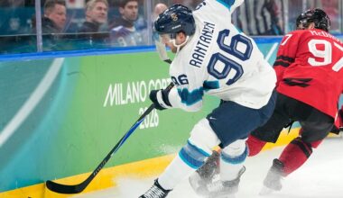 Finland's Mikko Rantanen (96) challenges with Canada's Connor McDavid (97) during a men's ice hockey semifinal game between Canada and Finland at the 2026 Winter Olympics, in Milan, Italy, Friday, Feb. 20, 2026. (AP Photo/Hassan Ammar)