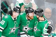 Dallas Stars center Joe Pavelski (center) celebrates his overtime goal with defenseman...
