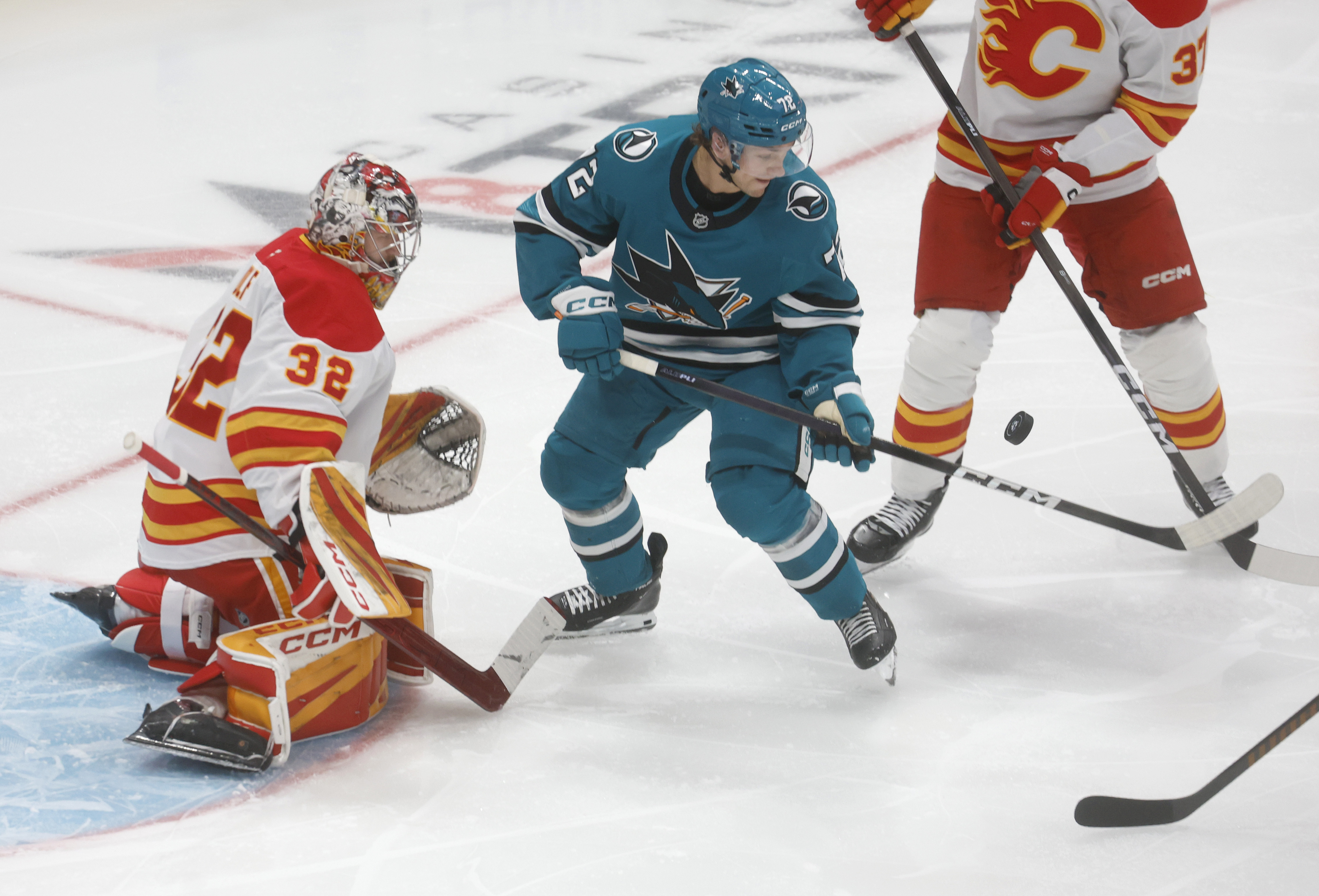 San Jose Sharks' William Eklund (72) fights for the puck...