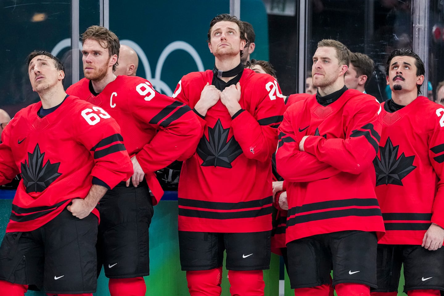 Brad Marchand (63), captain Connor McDavid and the rest of the Canadian team try to come to grips to losing Sunday's gold-medal final to the United States. 