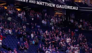 Fans stand for a 13-second moment of silence in memory of Columbus Blue Jackets' Johnny Gaudreau and his brother Matthew before the start of an NHL preseason hockey game against the St. Louis Blues, on Sept. 25, 2024, in Columbus, Ohio. The Gaudreau brothers were killed while riding their bicycles.