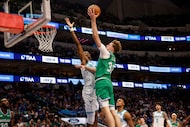 Dallas Mavericks forward Cooper Flagg (32) shoots over Charlotte Hornets forward Moussa...