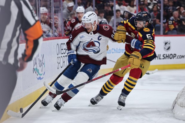 Gabriel Landeskog of the Colorado Avalanche battles Aaron Ekblad #5 of the Florida Panthers for puck control during the first period at Amerant Bank Arena on January 04, 2026 in Sunrise, Florida. (Photo by Carmen Mandato/Getty Images)