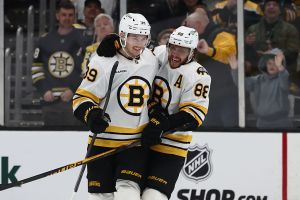 BOSTON, MA - JANUARY 24: David Pastrnak #88 of the Boston Bruins congratulates Morgan Geekie #39 after his goal put the Bruins ahead during the third period against the Montréal Canadiens at TD Garden on January 24, 2026 in Boston, Massachusetts. (Photo By Winslow Townson/Getty Images)