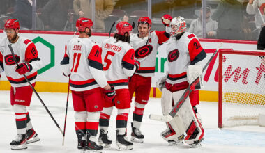 OTTAWA, ONTARIO - JANUARY 24: Brandon Bussi #32 of the Carolina Hurricanes celebrates a win with teammates Jordan Staal #11, Jalen Chatfield #5 and Jordan Martinook #48 after the game against the Ottawa Senators at Canadian Tire Centre on January 24, 2026 in Ottawa, Ontario. (Photo by Reuben Polansky-Shapiro/NHLI via Getty Images)