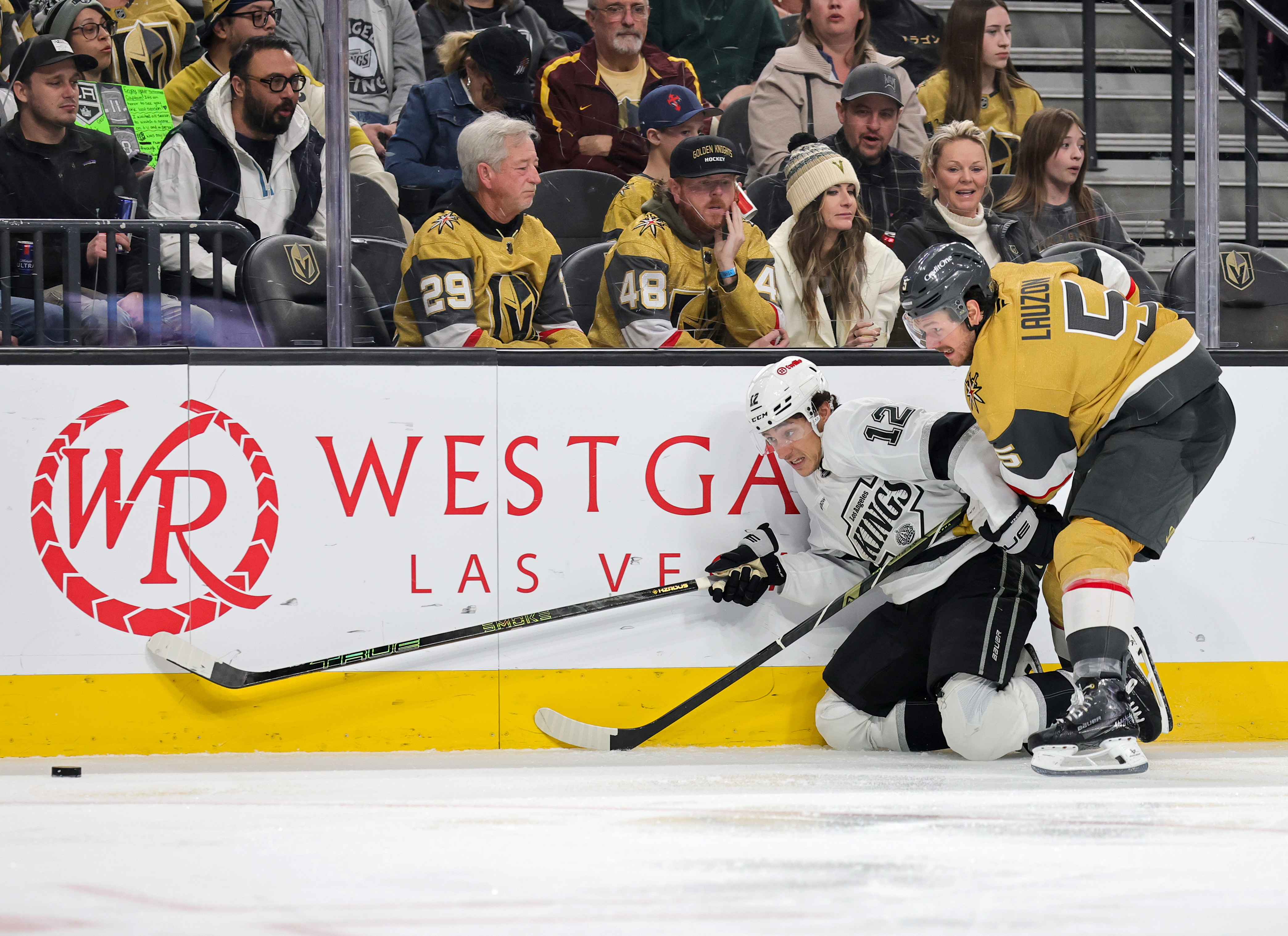 The Kings’ Trevor Moore, left, and the Vegas Golden Knights’...