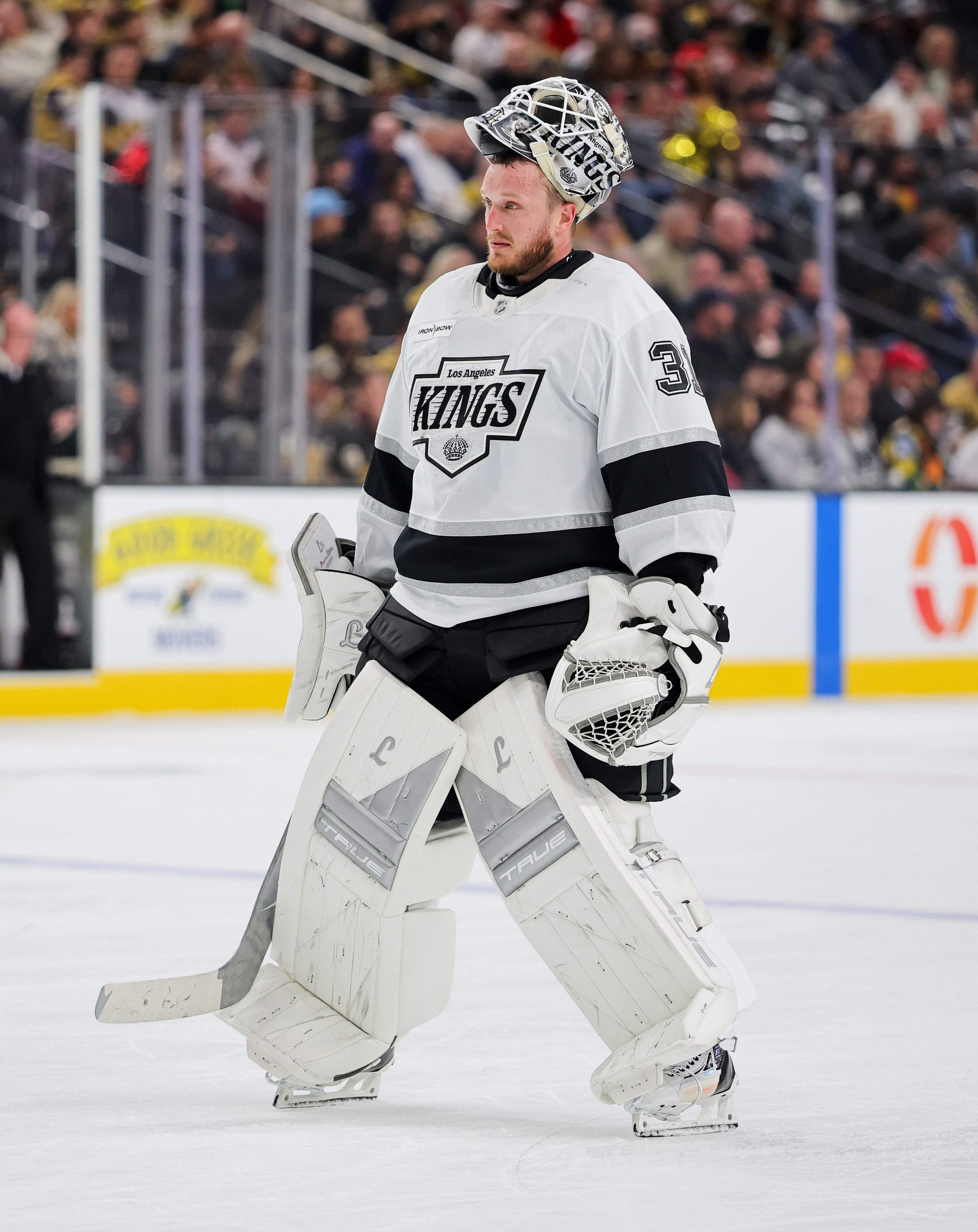 Kings goaltender Anton Forsberg takes a break during a pause...