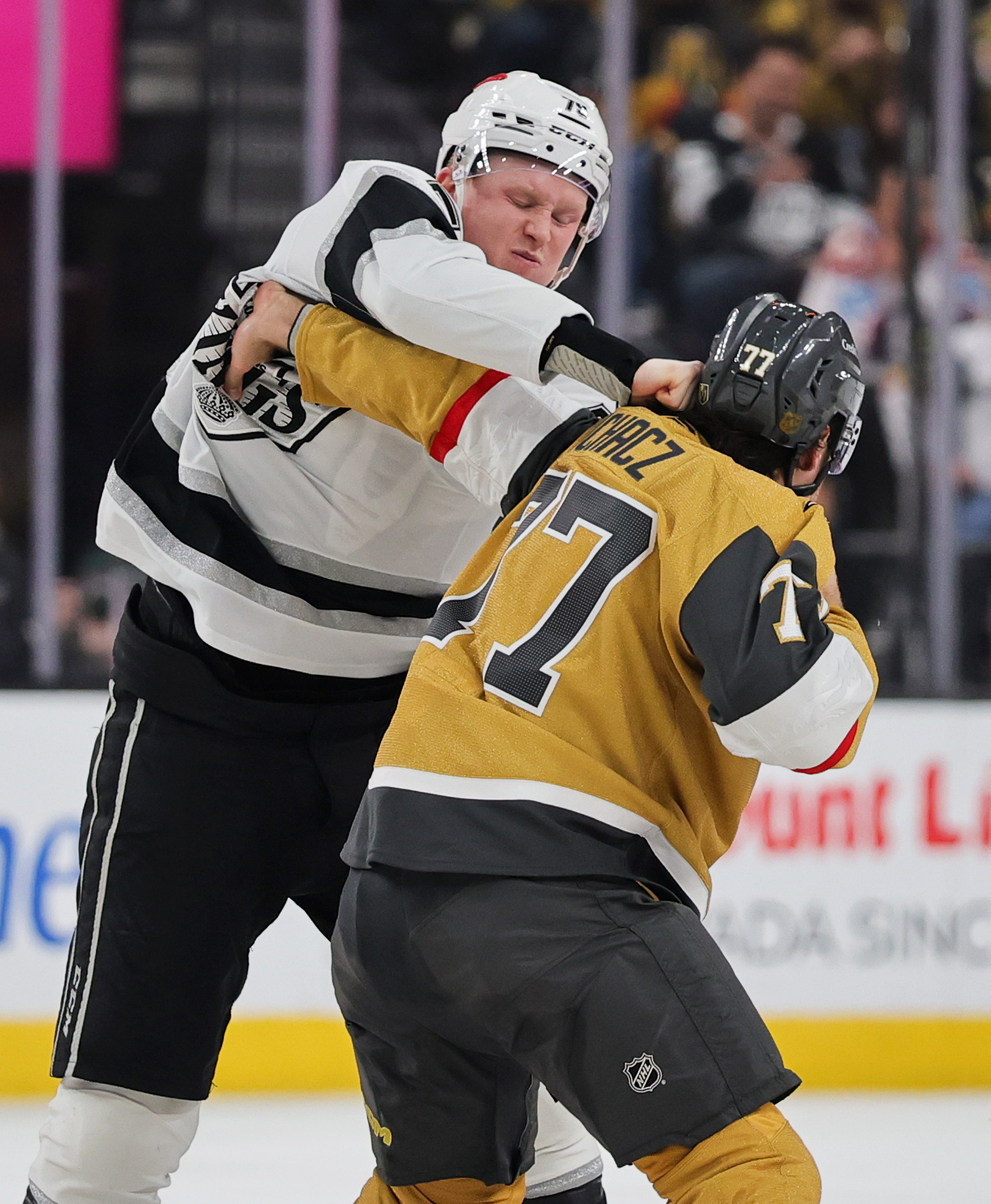 The Kings’ Samuel Helenius, left, and the Vegas Golden Knights’...