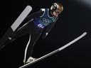 Norway's Marius Lindvik jumps during the ski jumping mixed team 1st round of the Milano Cortina 2026 Winter Olympic Games at Predazzo Ski Jumping Stadium in Predazzo (Val di Fiemme), on Feb. 10, 2026.