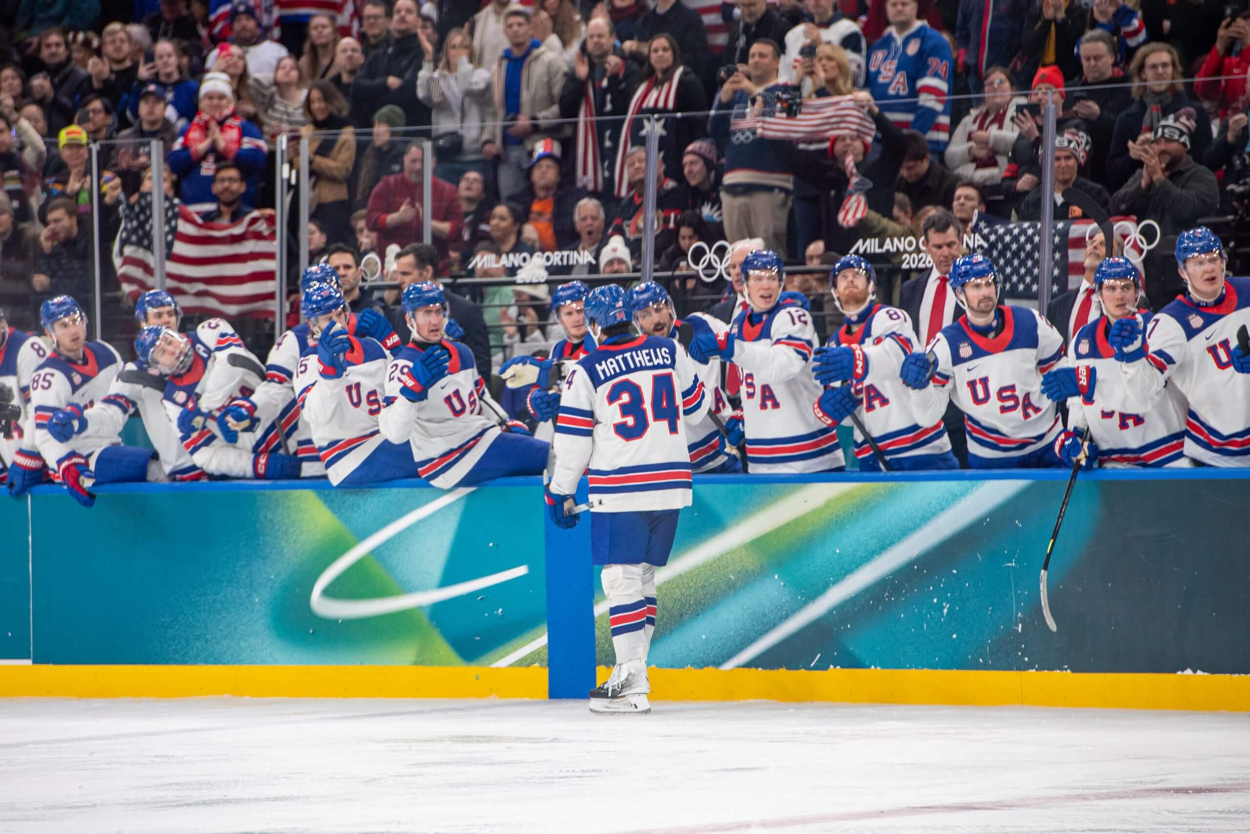 Auston Matthews makes his way down the Team USA fist-bump line after scoring.