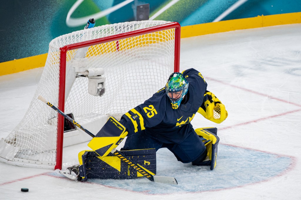 Goalie Jacob Markstrom #25 of Sweden makes a save during the Men's Preliminary Group B match between Sweden and Slovakia on day eight of the Milano Cortina 2026 Winter Olympic games at Milano Santagiulia Ice Hockey Arena on February 14, 2026 in Milan, Italy.