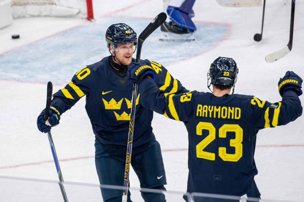  Elias Pettersson #40 of Sweden celebrates his goal with teammate Lucas Raymond #23 of Sweden during the Men's Preliminary Group B match between Sweden and Slovakia on day eight of the Milano Cortina 2026 Winter Olympic games at Milano Santagiulia Ice Hockey Arena on February 14, 2026 in Milan, Italy.