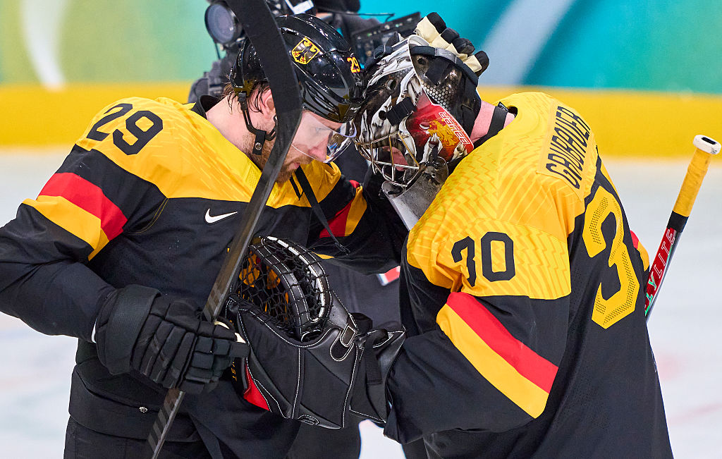 MILAN, ITALY - FEBRUARY 12: Philipp Grubauer Goalie of Germany Leon Draisaitl of Germany (NHL player with the Edmonton Oilers) celebrate after the Men's Preliminary Round Group C match between Germany and Denmark on day six of the Milano Cortina 2026 Winter Olympic games at Milano Rho Ice Hockey Arena on February 12, 2026 in Milan, Italy. (Photo by EyesWideOpen/Getty Images)