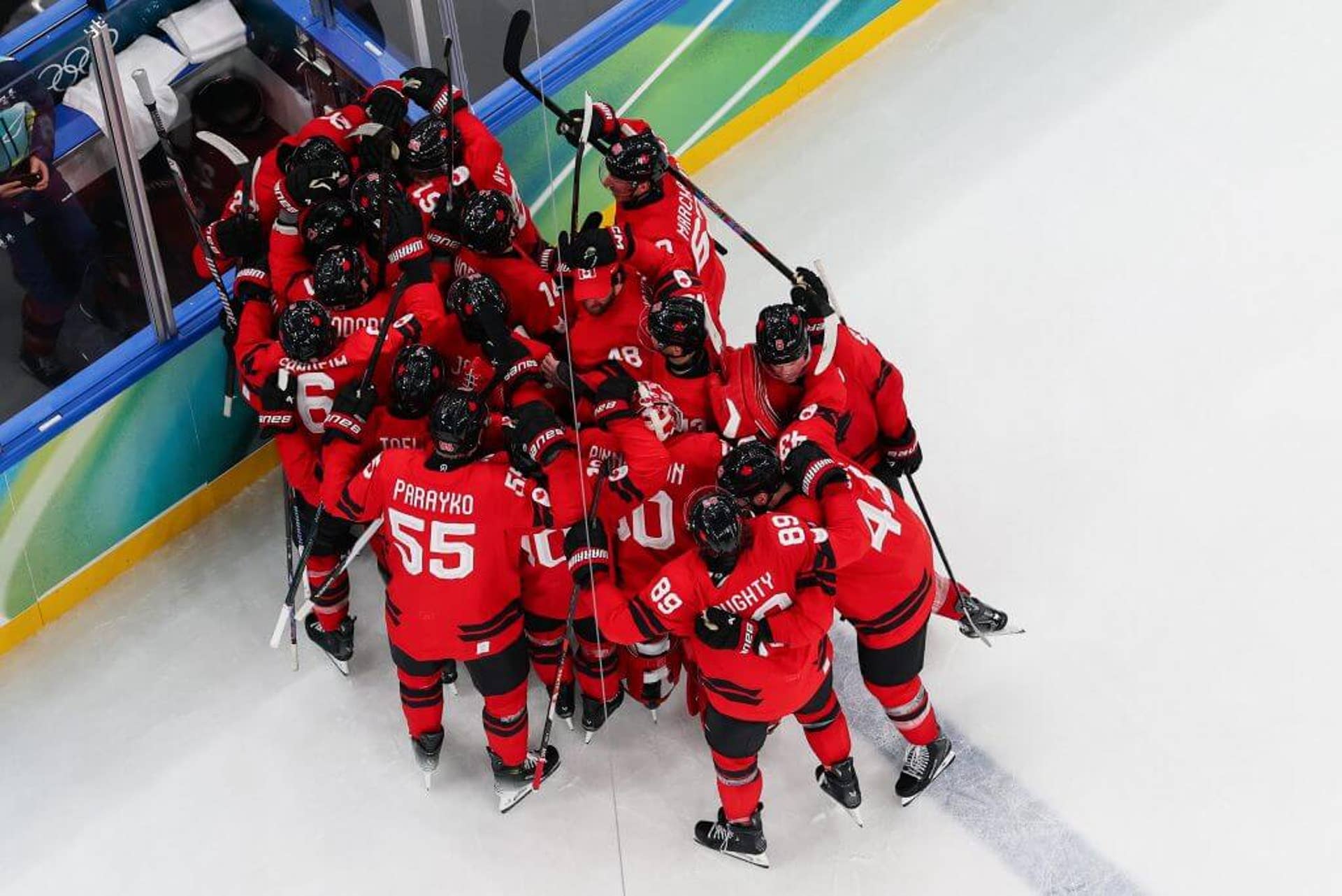 Team Canada celebrates its quarterfinal win in Olympic men's hockey