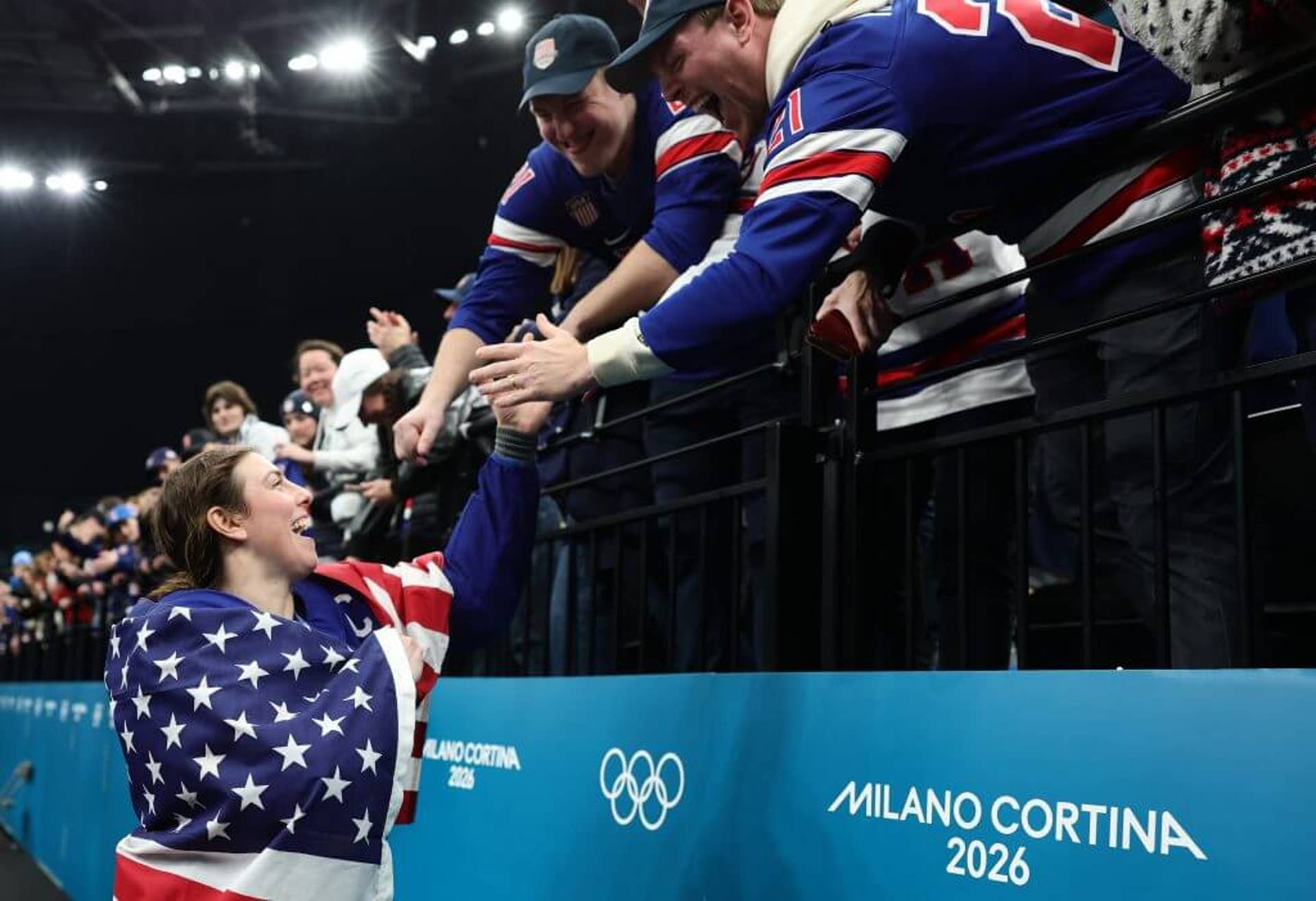Hilary Knight is pictured celebrating with fans after the women's hockey gold-medal game.