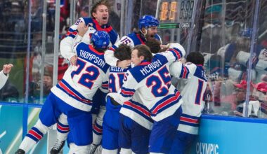Defenseman Charlie McAvoy (25) and the rest of the United States men's hockey team go crazy after beating Canada in overtime to win the gold medal at the Milan Cortina Olympic Games on Sunday.