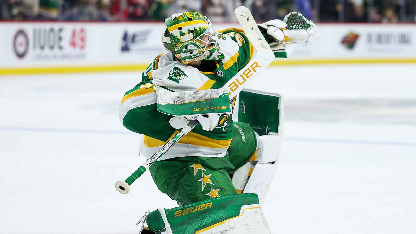 Minnesota Wild goaltender Jesper Wallstedt (30) celebrates his teams shootout win against the Chicago Blackhawks at Grand Casino Arena.