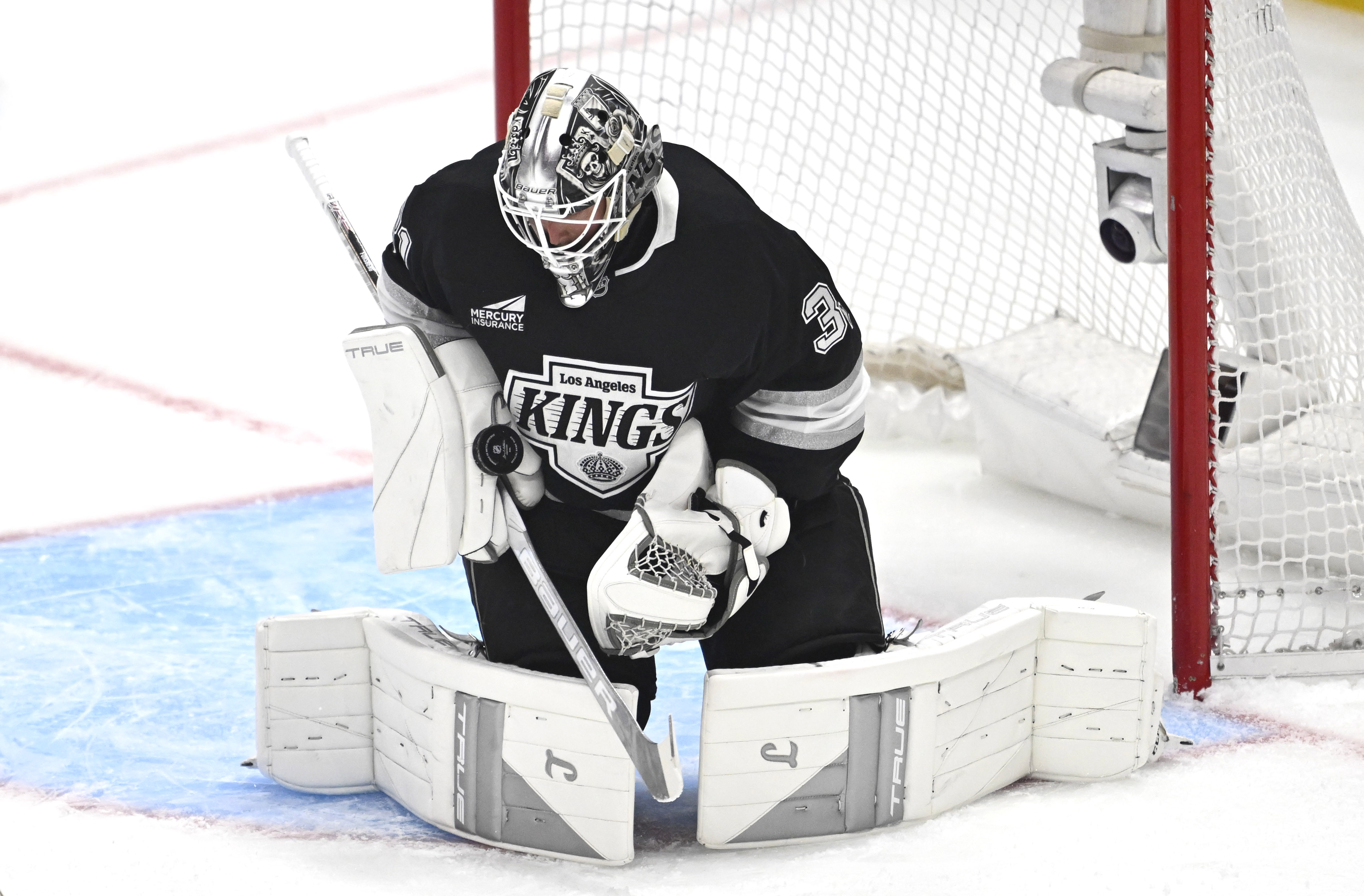 Kings goaltender Anton Forsberg blocks a shot during the first...